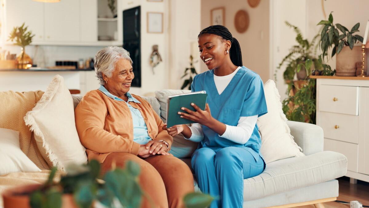 Caregiver supporting an older adult at home